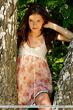 Charming, natural, and carefree beauty amidst lush vegetation. Charming, natural, and carefree beauty amidst lush vegetation.