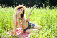 Brunette in the grass